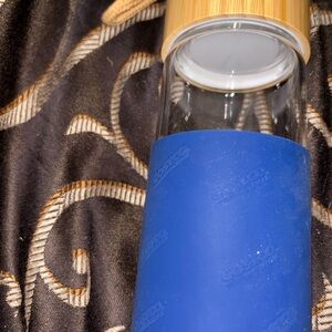 Glass Water Bottle with Blue Silicone Sleeve and Bamboo Lid